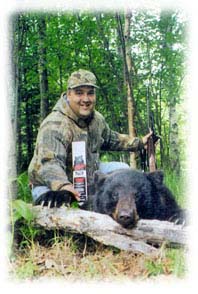 Photo of black bear and hunter