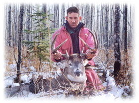 Deer hunter holding antlers